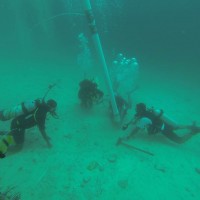 Underwater excavation in the Farasan Islands, offshore of Qumah, showing use of airlift with Faris Hamzi, Abdullah Al Haiti, Jumah Al Sadiq and Christin Mason (Photo: Garry Momber: 2014).