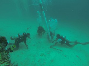 Figure 4: Faris Hamzi, Abdullah Al Haiti, Jumah Al Sadiq excavate with an airlift in 17m of water at Qumah, Farasan Island, under the supervision of Christin Mason (Photo: Garry Momber: 2014).